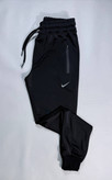 شلوار ورزشی مردانه مدل NIKE پارچه غواصی دمپا کش جیب دار تک رنگ مشکی